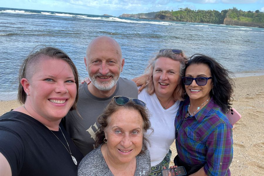 Kimberly with a group of friends on the beach in Kauai
